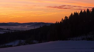 Preview wallpaper sky, trees, dawn, snow, clouds