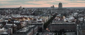 Preview wallpaper skyscraper, building, city, road, cars