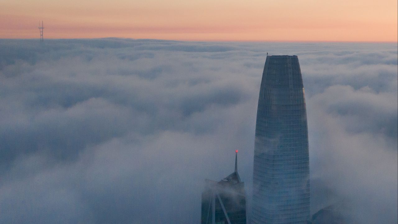 Wallpaper skyscraper, building, clouds, fog, city