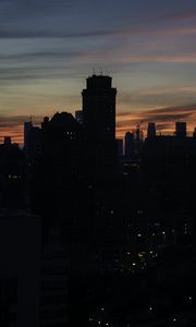 Preview wallpaper skyscraper, building, evening, dusk, sunset