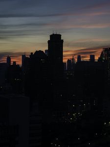 Preview wallpaper skyscraper, building, evening, dusk, sunset
