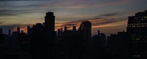 Preview wallpaper skyscraper, building, evening, dusk, sunset