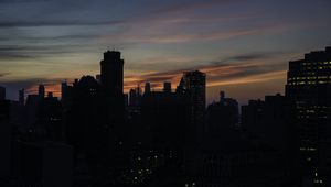 Preview wallpaper skyscraper, building, evening, dusk, sunset