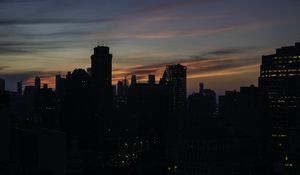 Preview wallpaper skyscraper, building, evening, dusk, sunset