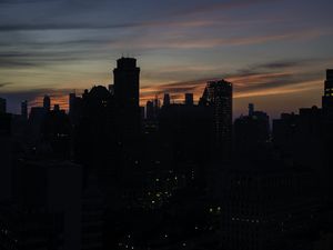 Preview wallpaper skyscraper, building, evening, dusk, sunset