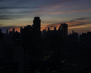 Preview wallpaper skyscraper, building, evening, dusk, sunset