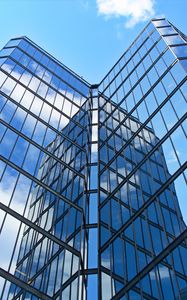 Preview wallpaper skyscraper, building, facade, glass, reflection