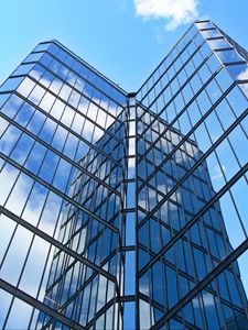 Preview wallpaper skyscraper, building, facade, glass, reflection