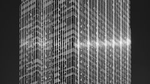 Preview wallpaper skyscraper, building, facade, architecture, glare, black and white