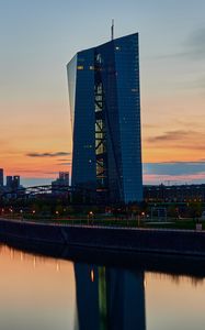 Preview wallpaper skyscraper, building, lights, bridge, river, twilight