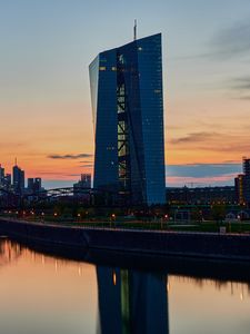 Preview wallpaper skyscraper, building, lights, bridge, river, twilight