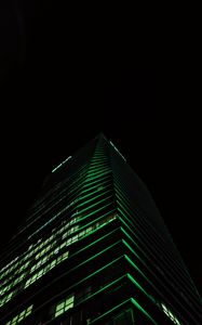 Preview wallpaper skyscraper, building, night, green, dark