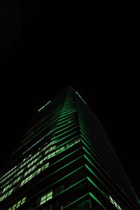 Preview wallpaper skyscraper, building, night, green, dark