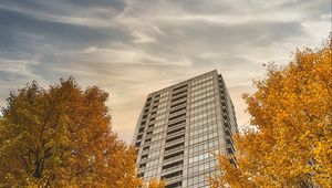 Preview wallpaper skyscraper, building, trees, architecture