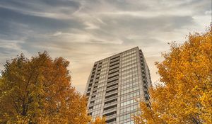 Preview wallpaper skyscraper, building, trees, architecture