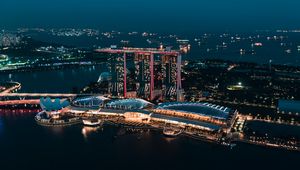 Preview wallpaper skyscraper, buildings, architecture, night, lights, sea