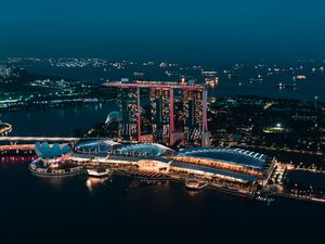 Preview wallpaper skyscraper, buildings, architecture, night, lights, sea