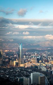 Preview wallpaper skyscraper, buildings, city, architecture, mountains, clouds