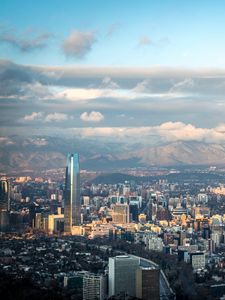 Preview wallpaper skyscraper, buildings, city, architecture, mountains, clouds