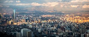 Preview wallpaper skyscraper, buildings, city, architecture, mountains, clouds