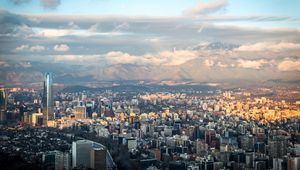 Preview wallpaper skyscraper, buildings, city, architecture, mountains, clouds