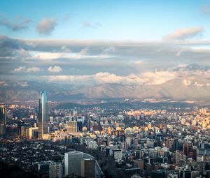 Preview wallpaper skyscraper, buildings, city, architecture, mountains, clouds