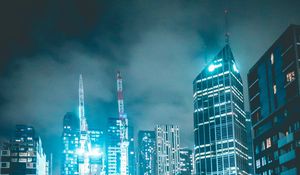 Preview wallpaper skyscraper, buildings, neon, night, architecture