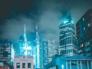 Preview wallpaper skyscraper, buildings, neon, night, architecture