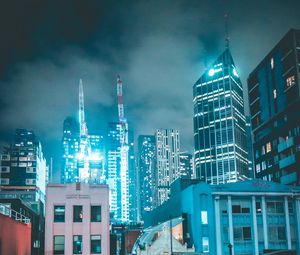 Preview wallpaper skyscraper, buildings, neon, night, architecture