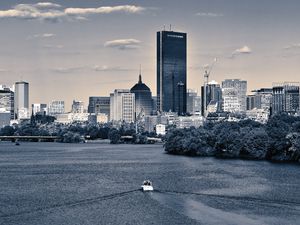 Preview wallpaper skyscraper, buildings, river, trees, boat, city