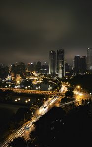 Preview wallpaper skyscraper, buildings, road, lights, city, night