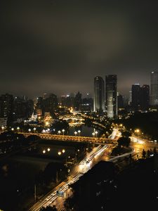 Preview wallpaper skyscraper, buildings, road, lights, city, night