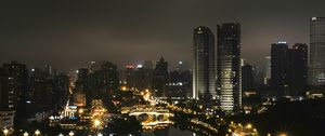 Preview wallpaper skyscraper, buildings, road, lights, city, night