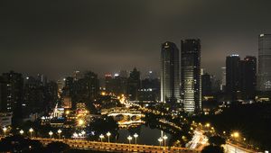 Preview wallpaper skyscraper, buildings, road, lights, city, night