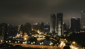 Preview wallpaper skyscraper, buildings, road, lights, city, night