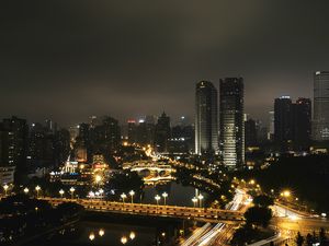 Preview wallpaper skyscraper, buildings, road, lights, city, night