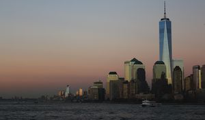 Preview wallpaper skyscraper, buildings, sea, boat, evening