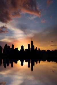 Preview wallpaper skyscraper, buildings, silhouette, reflection, sky