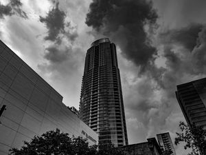 Preview wallpaper skyscraper, bw, facade, clouds