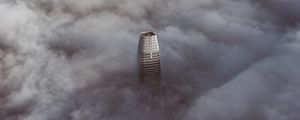 Preview wallpaper skyscraper, clouds, aerial view, building, top, height