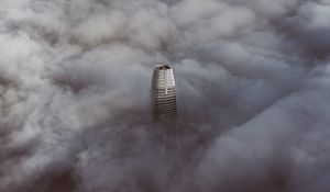 Preview wallpaper skyscraper, clouds, aerial view, building, top, height