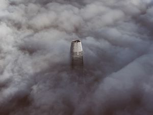 Preview wallpaper skyscraper, clouds, aerial view, building, top, height