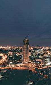 Preview wallpaper skyscraper, construction, buildings, lights, night, city