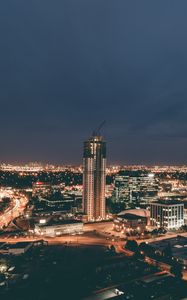Preview wallpaper skyscraper, construction, buildings, lights, night, city