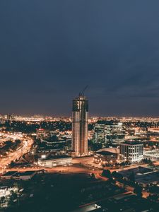 Preview wallpaper skyscraper, construction, buildings, lights, night, city