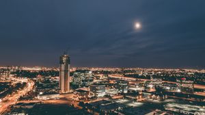 Preview wallpaper skyscraper, construction, buildings, lights, night, city