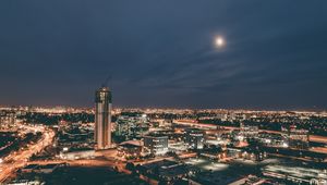 Preview wallpaper skyscraper, construction, buildings, lights, night, city