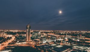 Preview wallpaper skyscraper, construction, buildings, lights, night, city