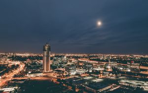 Preview wallpaper skyscraper, construction, buildings, lights, night, city