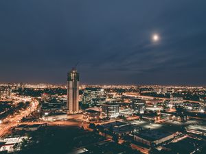 Preview wallpaper skyscraper, construction, buildings, lights, night, city